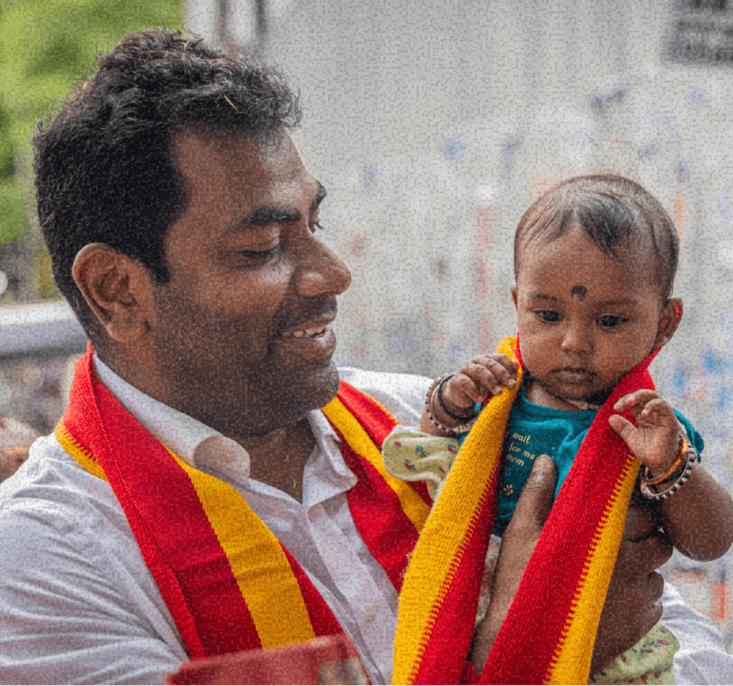 Aadhav Arjuna with a child